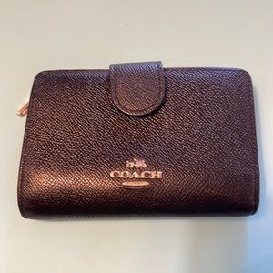 Black textured leather Coach Wallet with silver hardware.